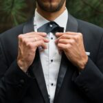 Groom at wedding tuxedo in the forest